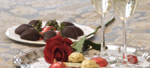 Chocolate Strawberries, rose, candy, champagne glasses on silver tray