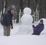 Frank and Christine building a snowman