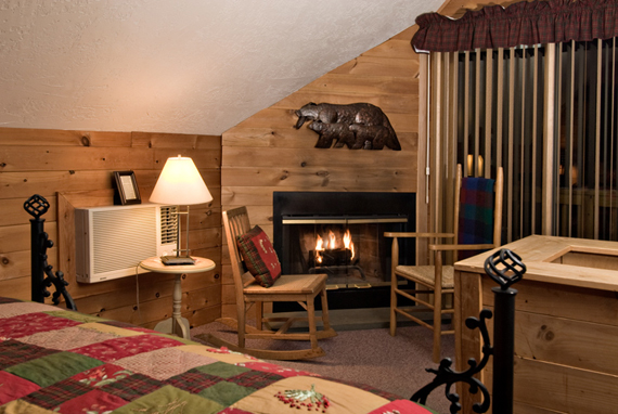 Ellis River Cottage bedroom with fireplace
