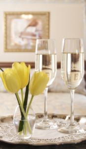 Yellow tulips and glasses of champagne