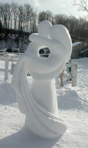 snow sculpture of two people embracing